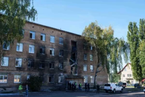 Ukrainian police inspect a Kyiv school damaged by a Russian drone strike